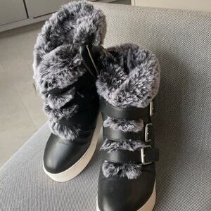 J Slides booties: Fur lined faux) lifted heel booties.